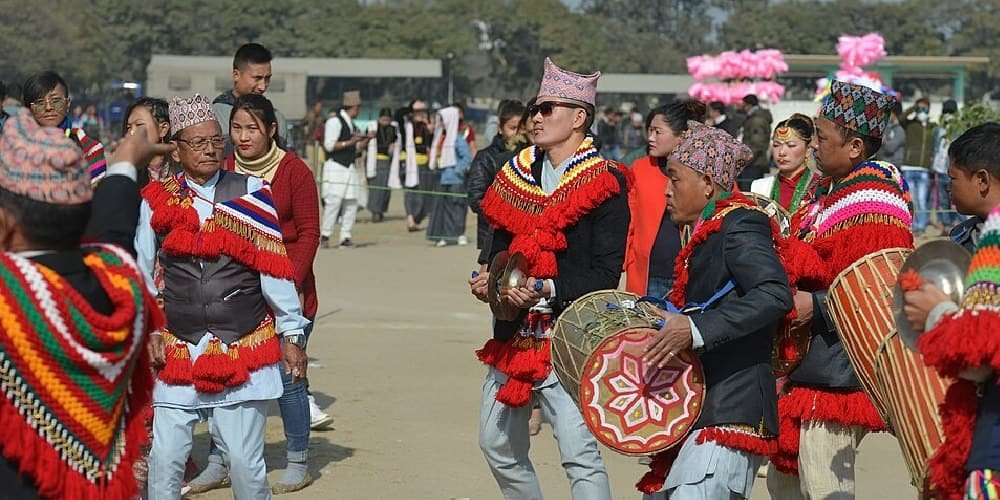 Sakela celebration with Rai community members performing traditional music and dance in cultural dress.