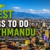 Things to do in Kathmandu, Nepal, featuring a panoramic city view, colorful neighborhoods, historic temples, and the surrounding valley hills.